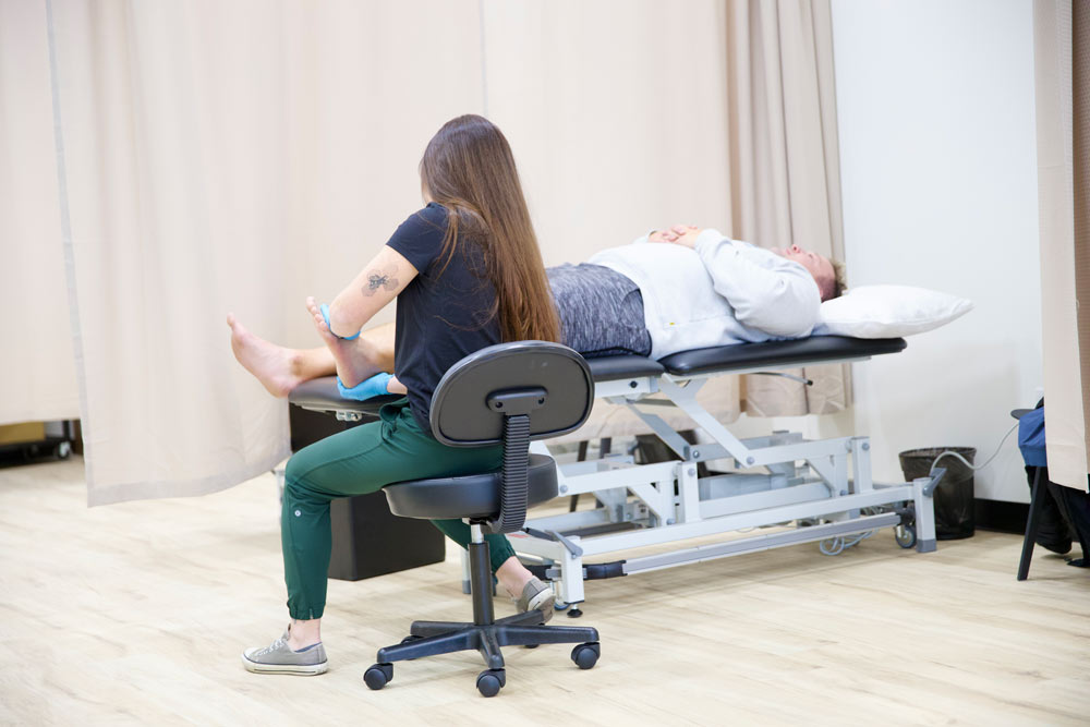 Therapist giving her patient a massage in St. Albert, AB