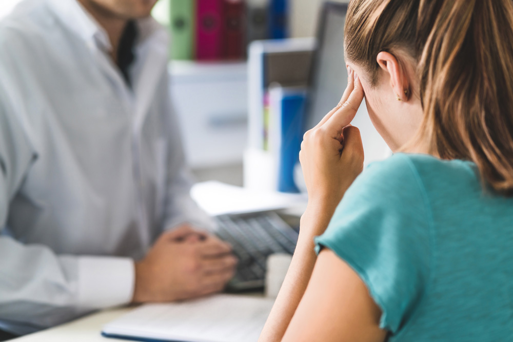 Woman suffering from a concussion